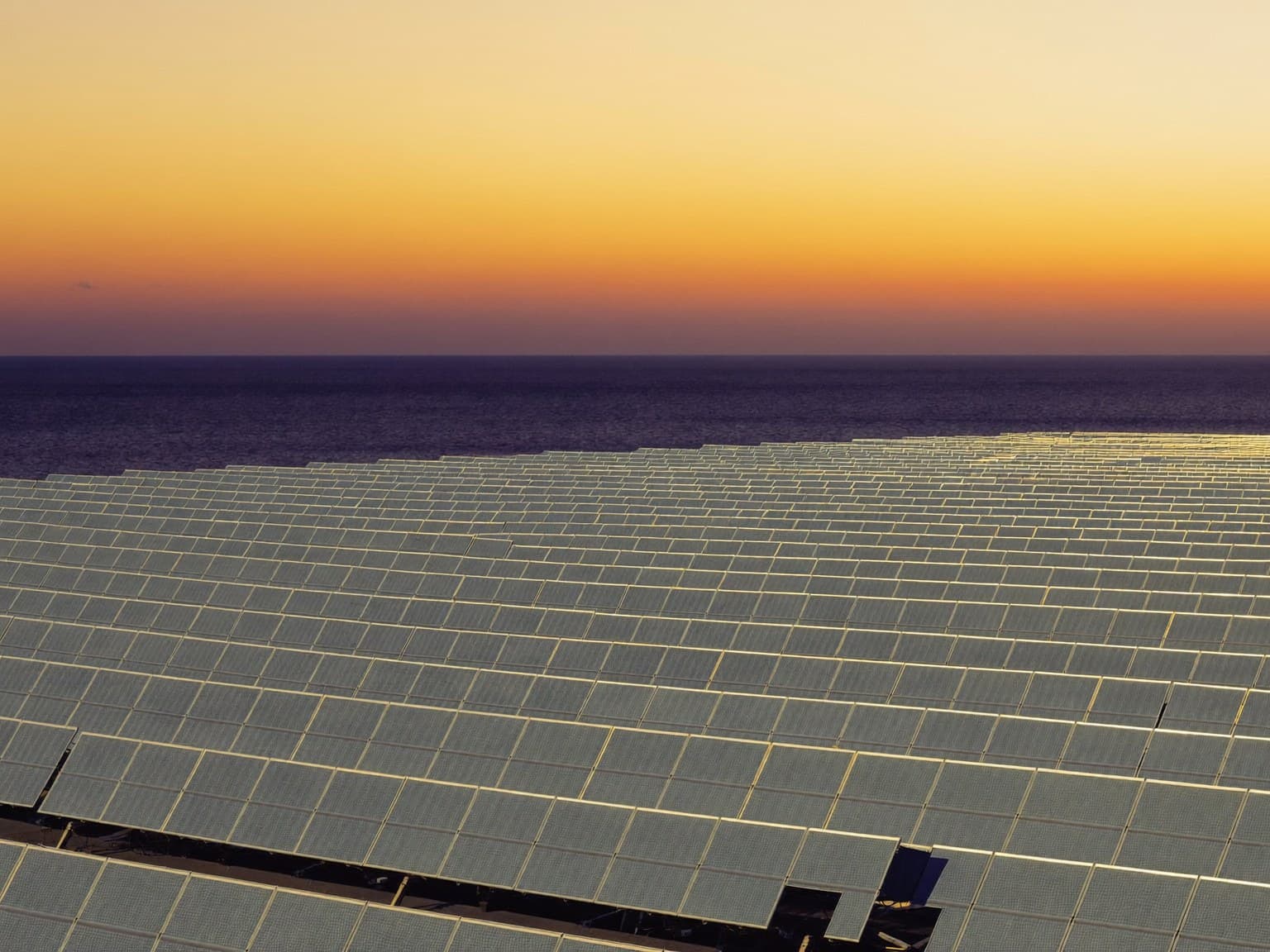 Solar array at dusk overlooking the East African coast