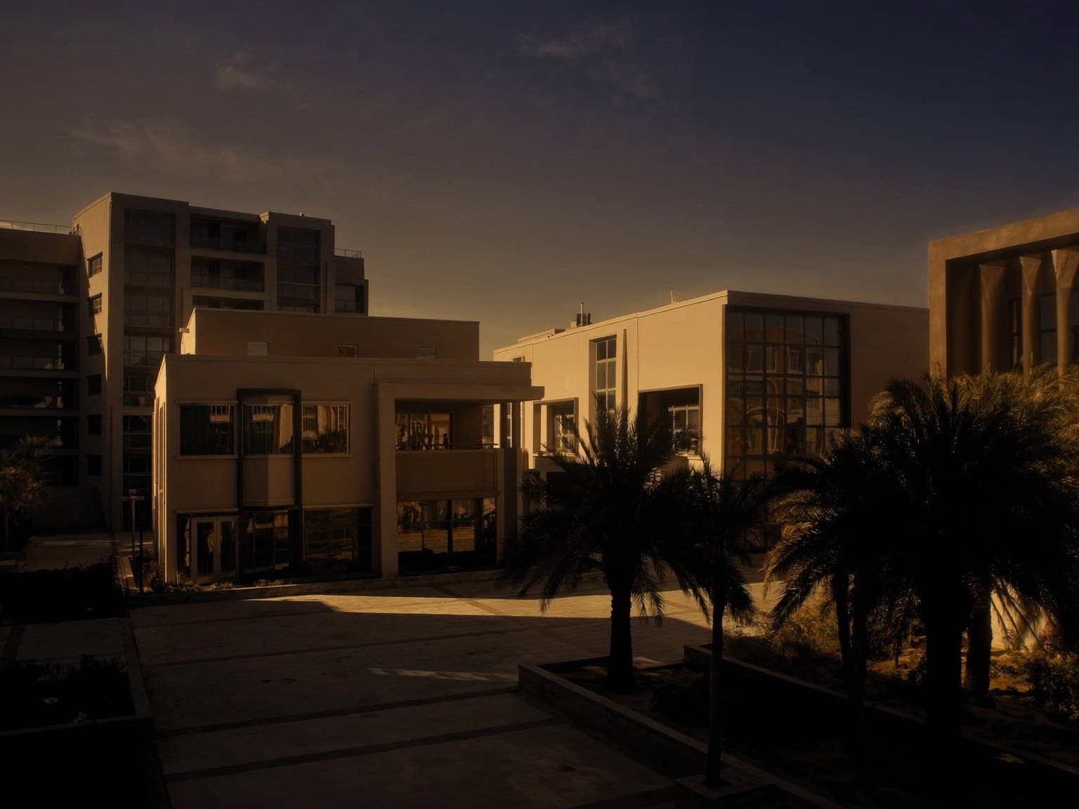 Mixed-use residential development at dusk